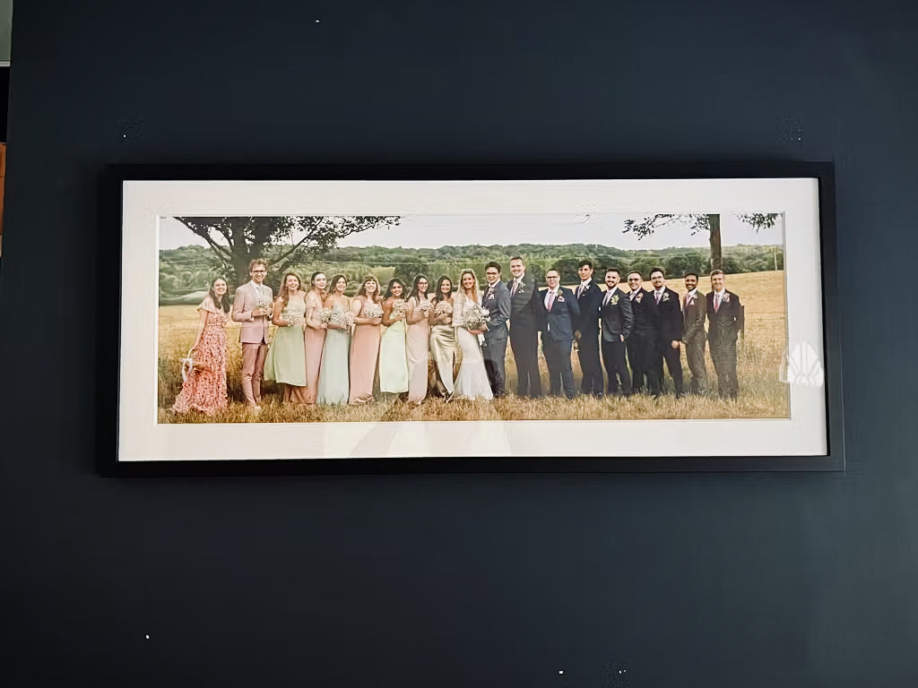 a customers image of their wedding photo framed and hanging on the wall
