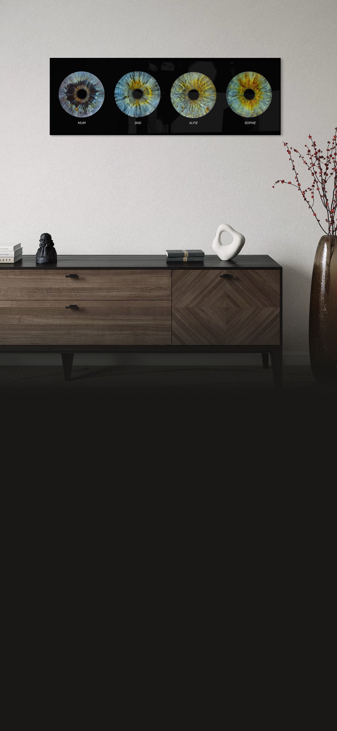 Wooden sideboard with decorative items against a white wall with a family iris eye artwork.