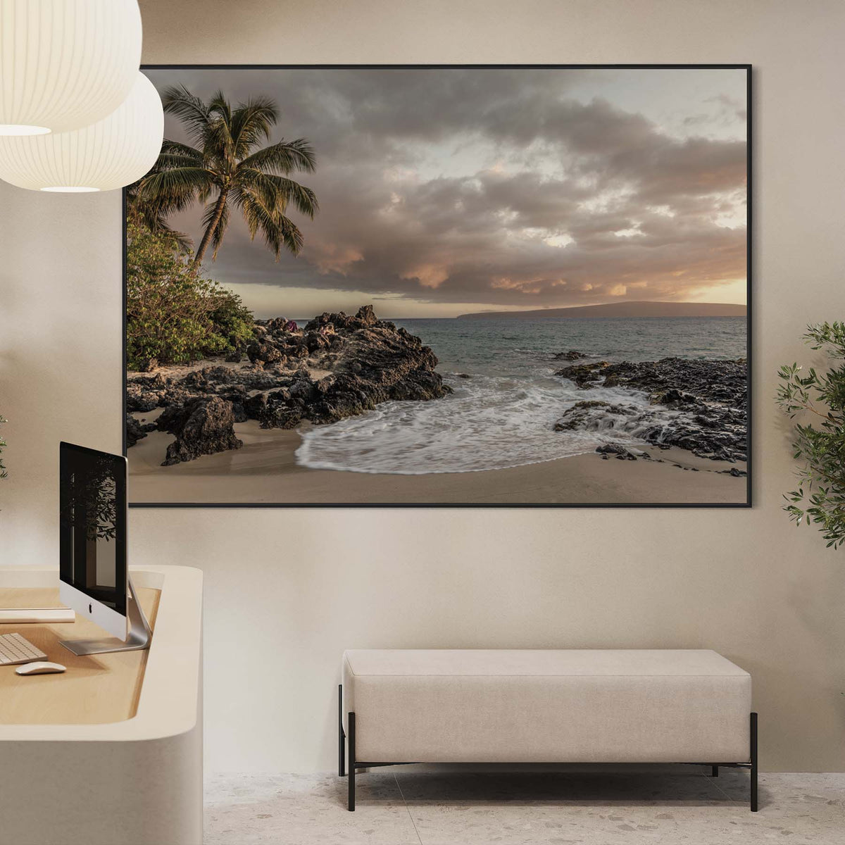 Extra-large framed canvas showing a coastal landscape above an office reception bench